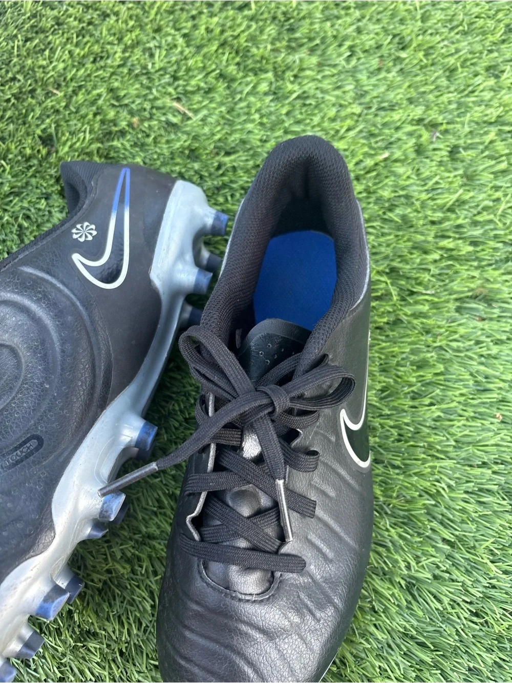 Nike Kids Black Soccer Cleats with Blue Accents